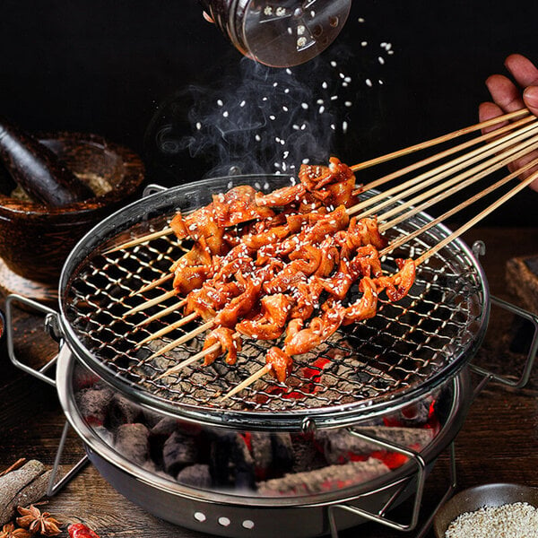 Ruostumattomasta teräksestä valmistettu ulkogrilli pyöreä kokoontaittuva grilli Kannettava japanilainen retkeily BBQ Grill Kotiliesi laatikolla